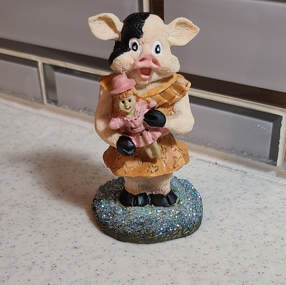 Vintage Ceramic Cow Figurine with Pink and Black Accents